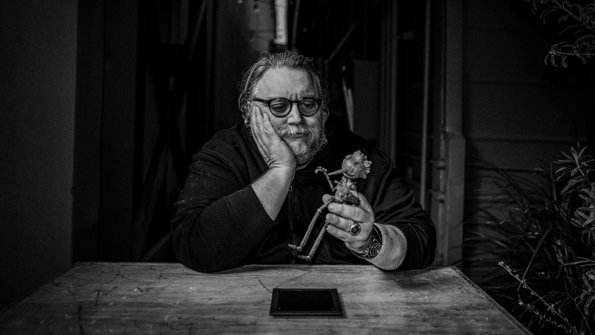 director guillermo del toro with a Pinocchio figurine